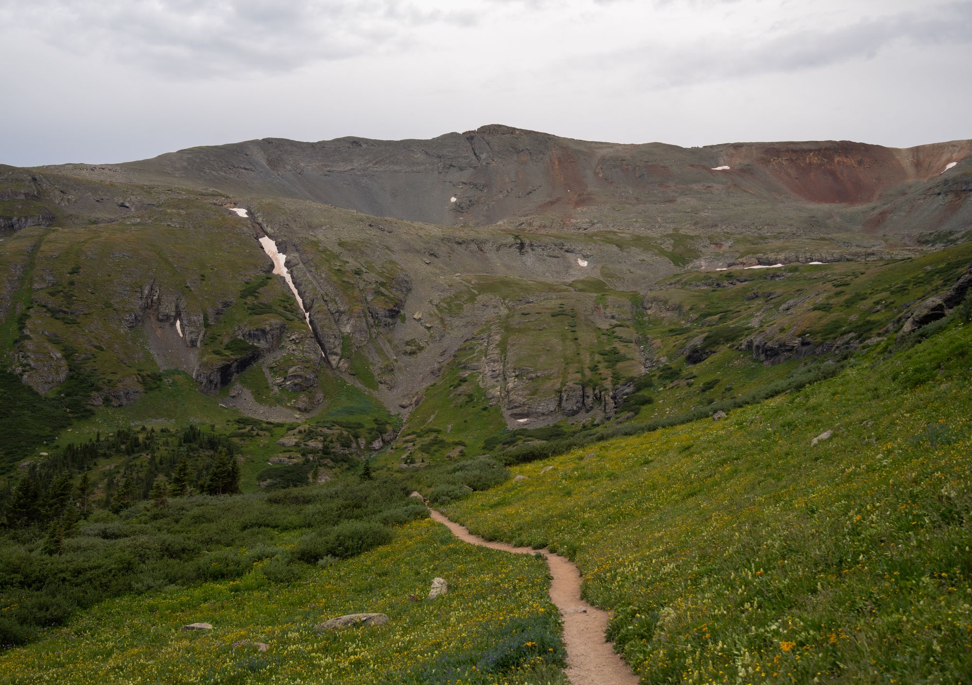 A winding trail through a mountain valley — temporary landscape photograph